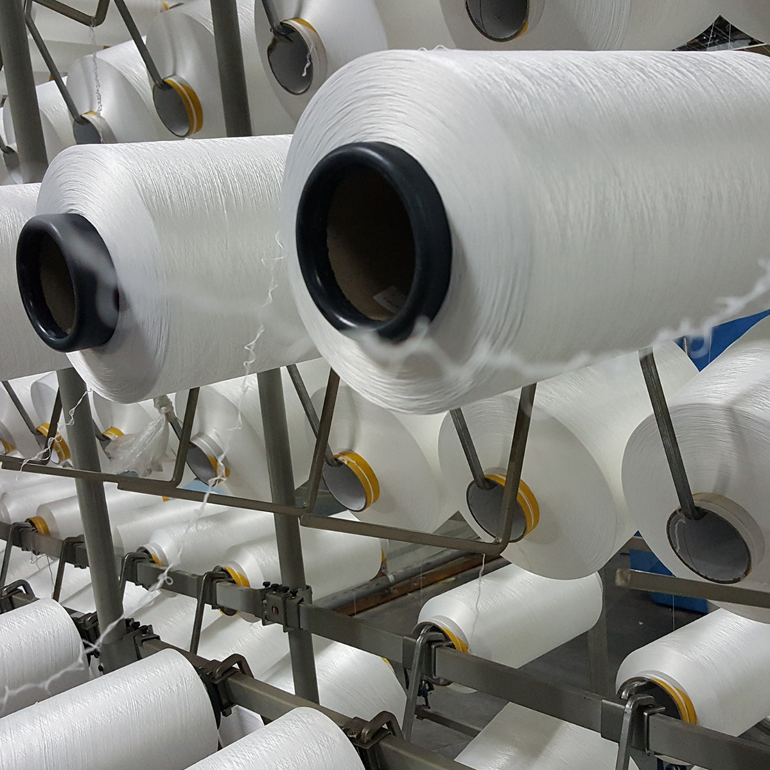 Manufacturer in stock AA high quality polyester 300D bottom elastic silk white fiber for knitting woven fabric ribbon