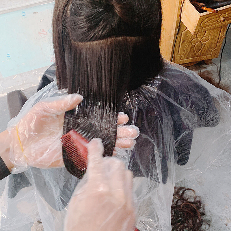 Disposable hair dyeing shawl hair cutting hairdressing oil plastic cloth barber shop hot hair dyeing shawl cloth manufacturers