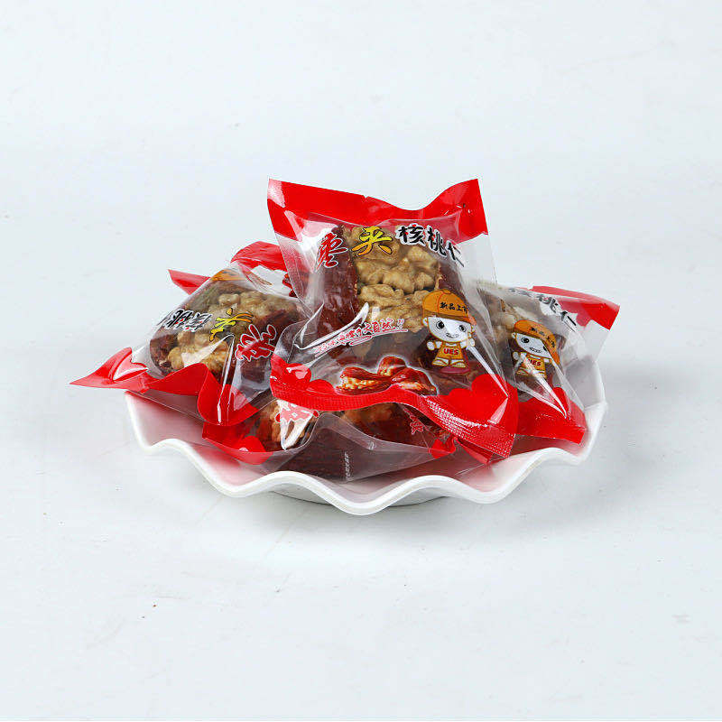 Wholesale Xinjiang jujube with walnut kernel 500g Hotan jujube walnut kernel with raisins snack snacks