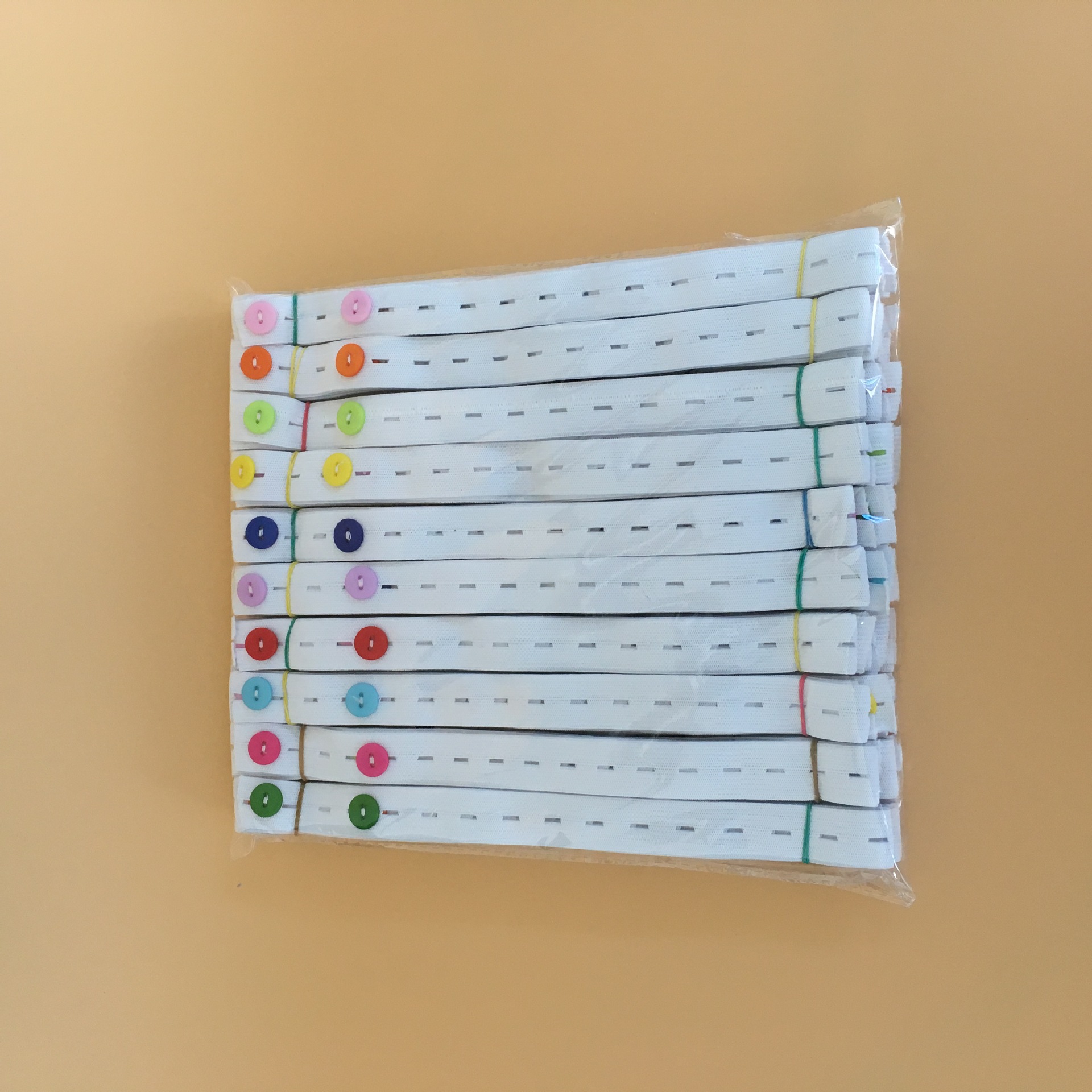 Factory wholesale baby diaper buckle baby diaper fixing belt binding diaper adjustable elastic band buttonhole belt