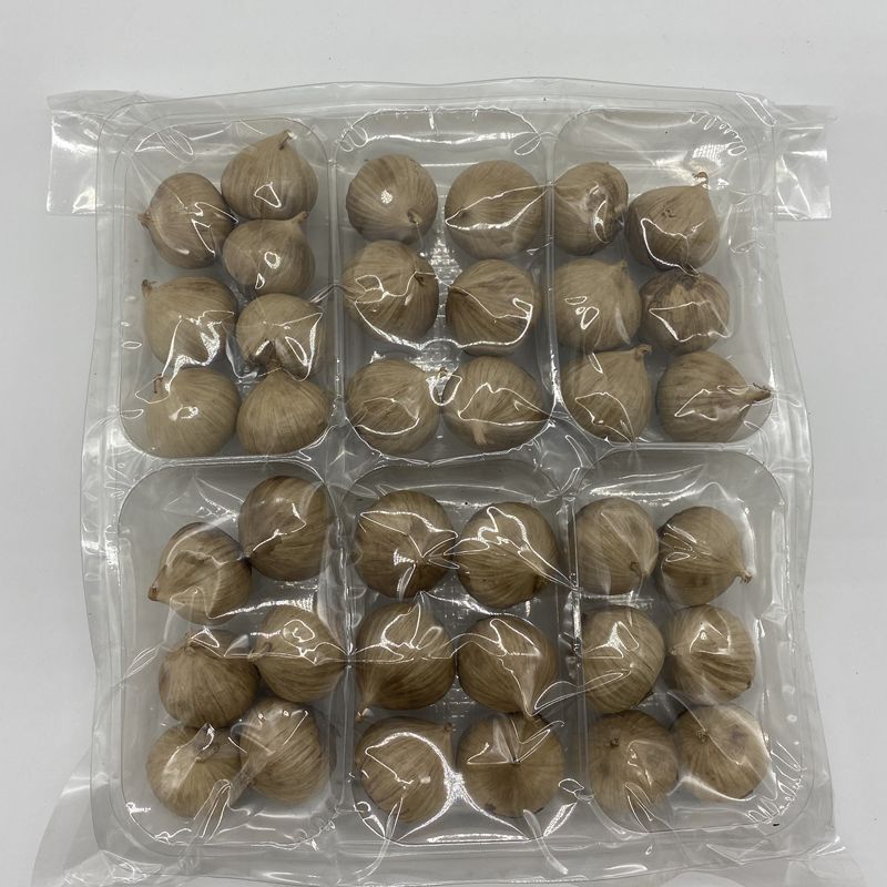 Perennial supply of single-headed black garlic 100g source factory straight hair foot fermentation soft waxy sweet and sour peeling ready-to-eat
