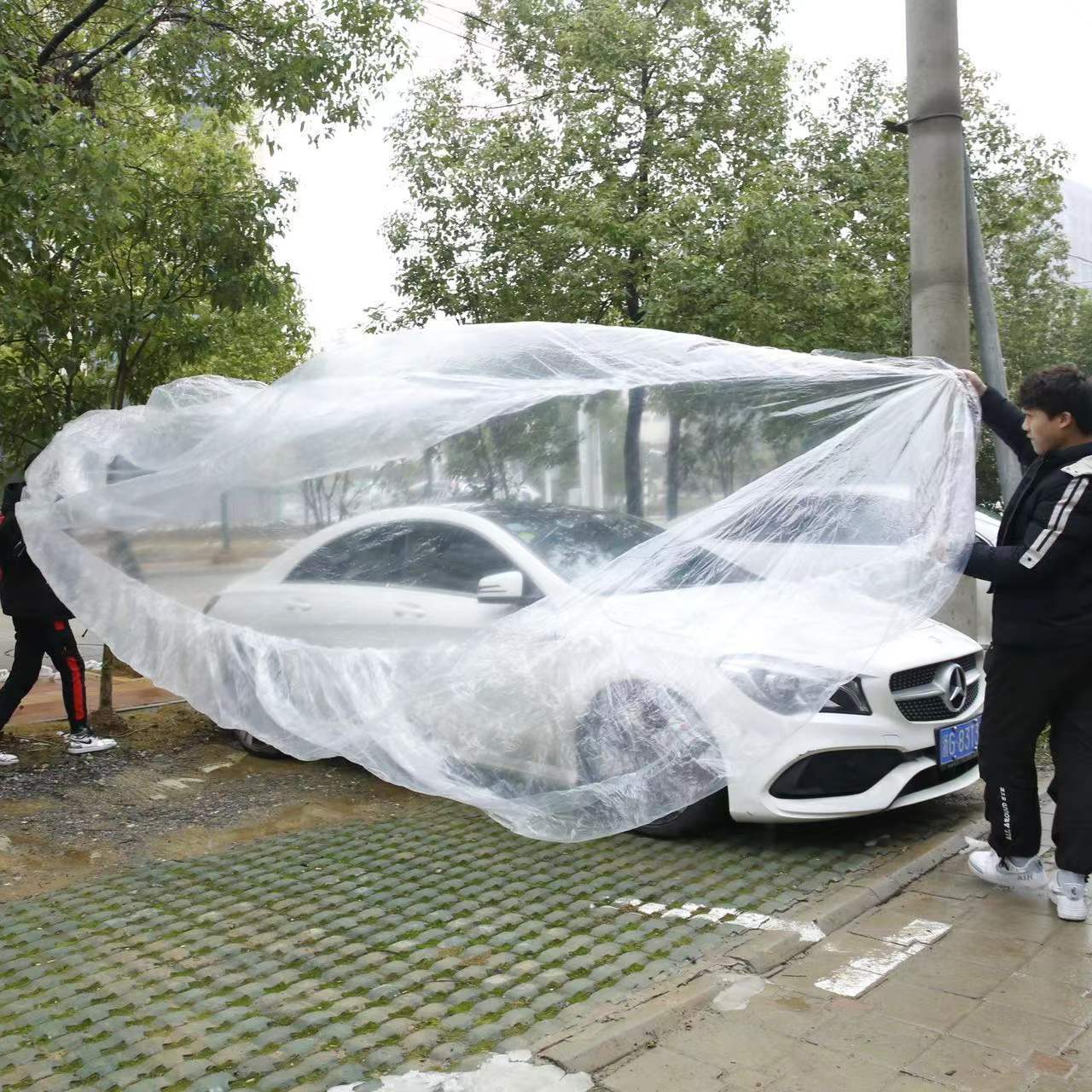 Factory Direct Supply Pe Film Car Cover Thickeneded Disposable Car Cover Transparent Plastic Rainproof and Dustproof