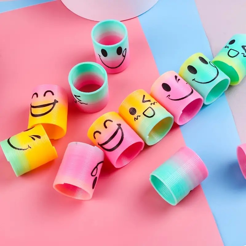 Cross-Border Rainbow Circle Expression Smiley Face Bouncing Circle Children's Educational Spring Circle Toy Yiwu Wholesale Gift Stall