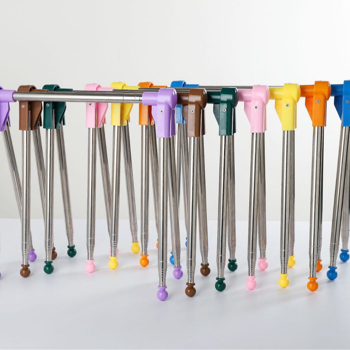 Telescopic folding indoor balcony floor stainless steel clothes hanger travel hotel clothes pole storage artifact