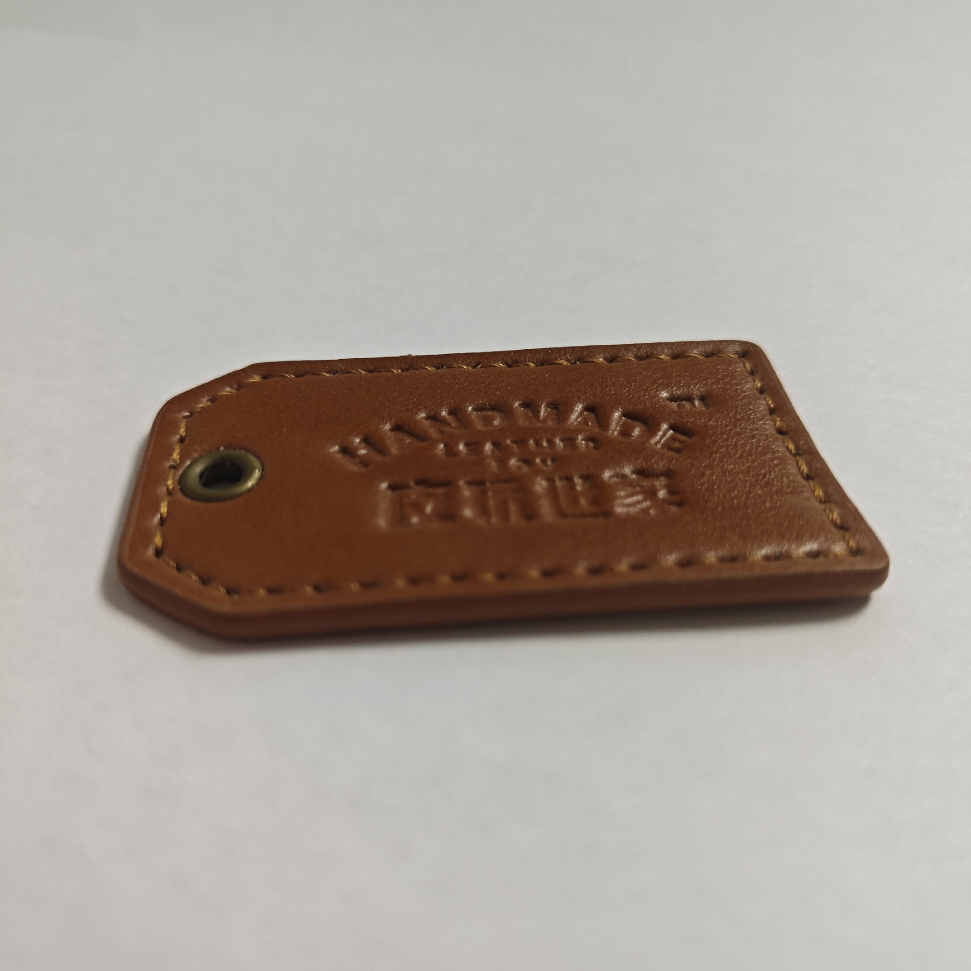 Custom-Made Pu Leather Labels and Tags, Faux Leather and Genuine Leather for Jeans, Hats, Waist Tags, Shoe Materials, Bags, and Artificial Leather Texture