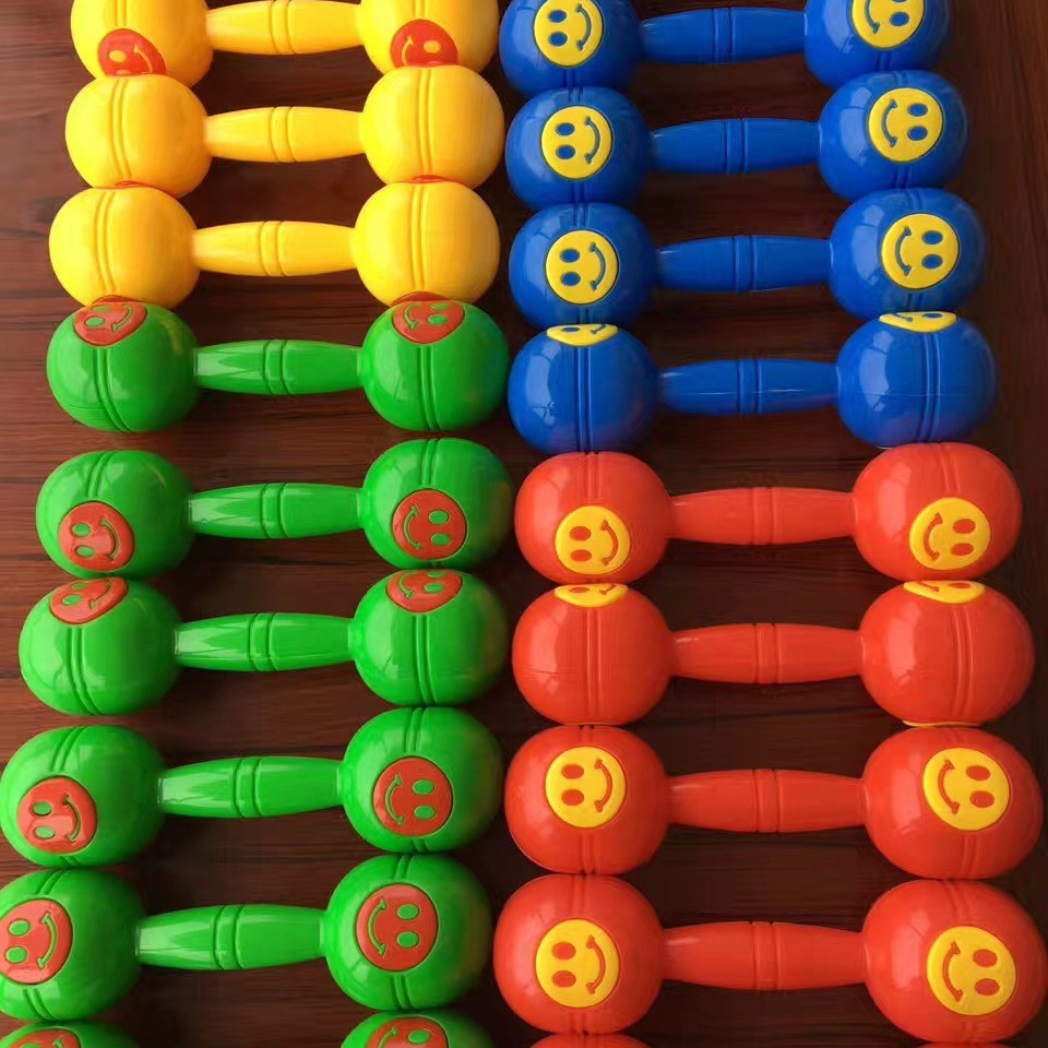Kindergarten children morning exercise dumbbell rattle wholesale large size smiley face dumbbell gymnastics dumbbell smiley face dumbbell