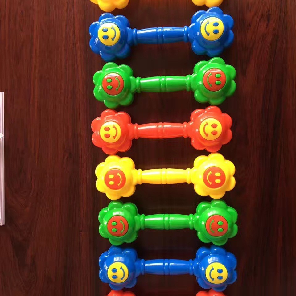 Kindergarten children morning exercise dumbbell rattle wholesale large size smiley face dumbbell gymnastics dumbbell smiley face dumbbell