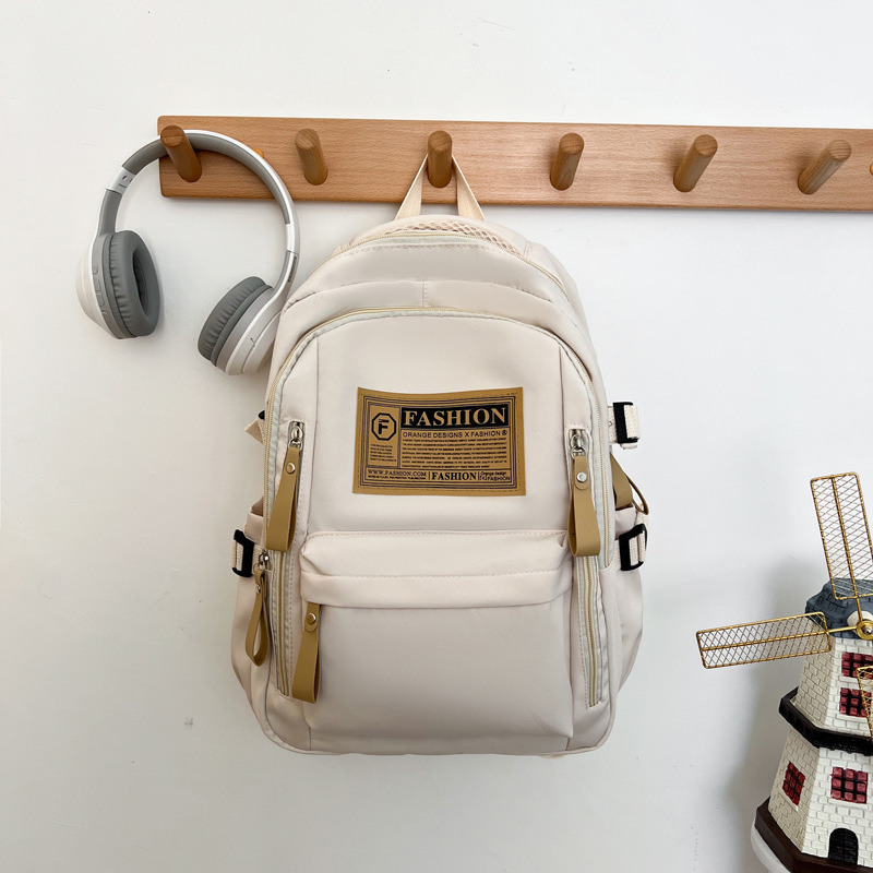 2025 New Cross-Border Schoolbags for Female Students Nylon Retro Simple Junior High School Students Male Large Capacity Schoolbags