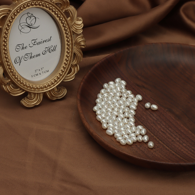 A large number of spot wholesale 4mm natural freshwater pearl rice beads half hole loose beads diy jewelry materials