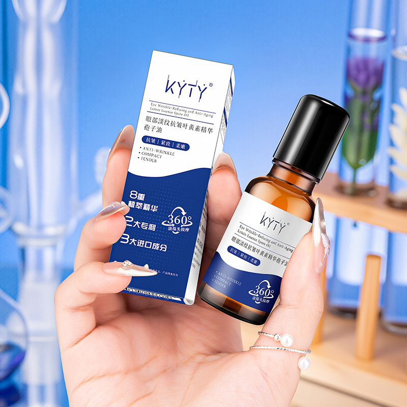 Kyty Eye Lightening Lutein Essence Spore Oil Fading Fine Lines Anti-Wrinkle Roll-On Eye Oil Firming Eye Cream Wholesale