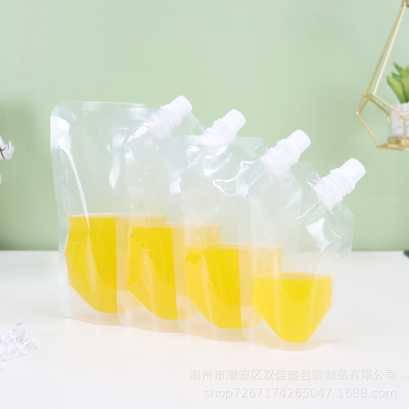 In stock transparent self-standing oblique pocket juice beverage suction nozzle plastic food bag milk tea soybean milk packing bag wholesale