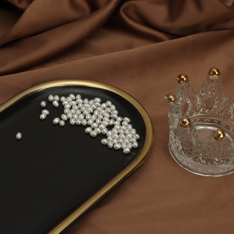 A large number of spot wholesale 4mm natural freshwater pearl rice beads half hole loose beads diy jewelry materials