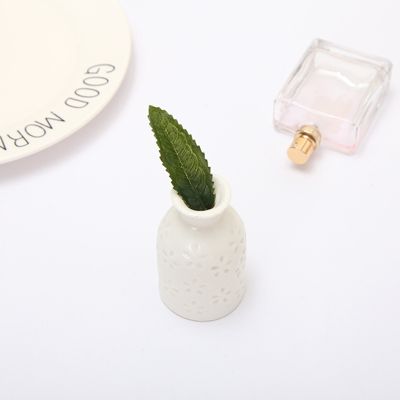 Simulation family green plant ornaments lemon leaf accessories DIY lemon tree leaves Guangdong kapok leaf manufacturers wholesale