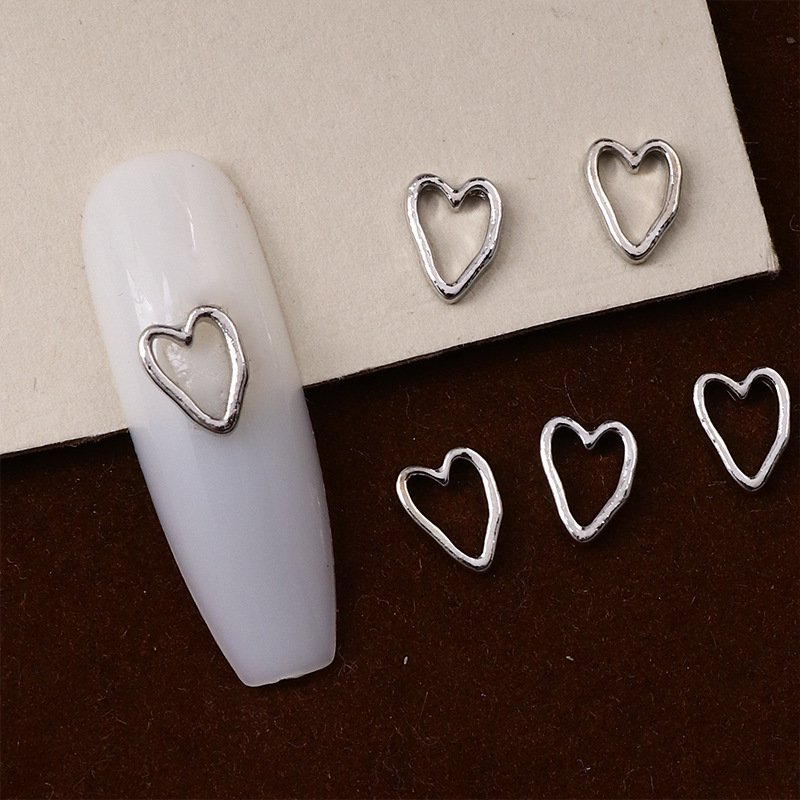 New alloy love nail art accessories Japanese niche retro hollow love smooth three-dimensional crooked heart nail art accessories
