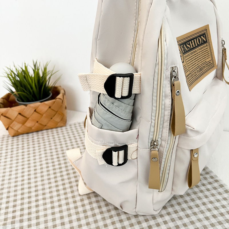 2025 New Cross-Border Schoolbags for Female Students Nylon Retro Simple Junior High School Students Male Large Capacity Schoolbags