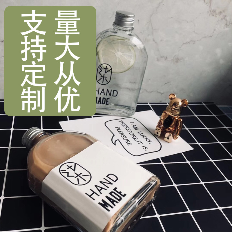 Factory sales new juice beverage bottle flat wine bottle coffee cold drink milk tea bottle light cut-off oblique shoulder flat glass empty bottle