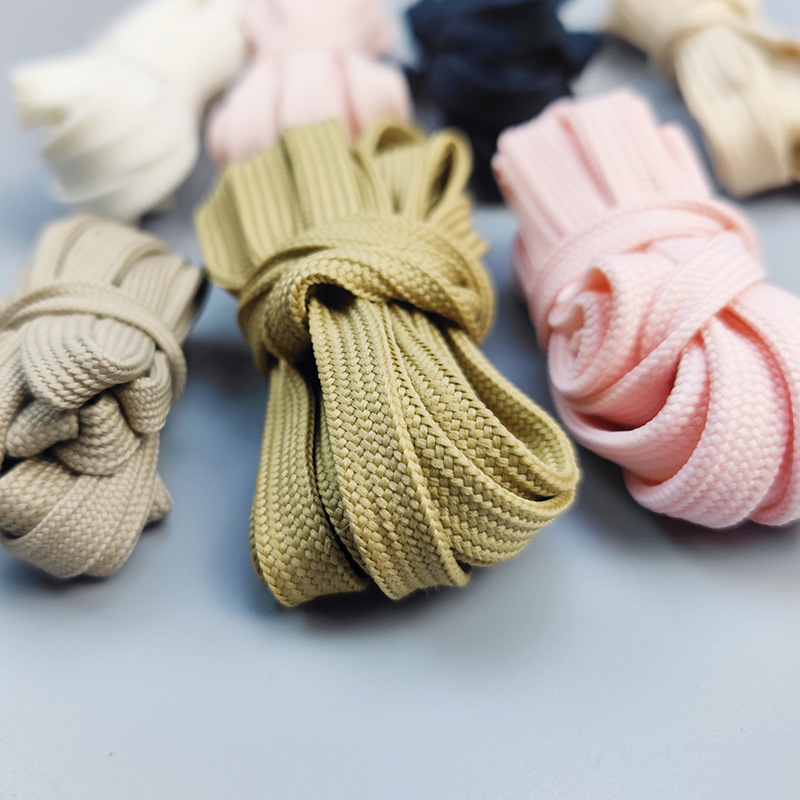 Factory sales 40 ingots low elastic silk double-layer hollow shoelace polyester thickened 1CM black and white flat shoelace waist rope hat rope