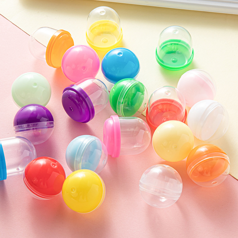 Factory wholesale twisted eggshell 28mm toy mixed color twisted egg eggshell twisted egg machine plastic blind ball toy ball shell