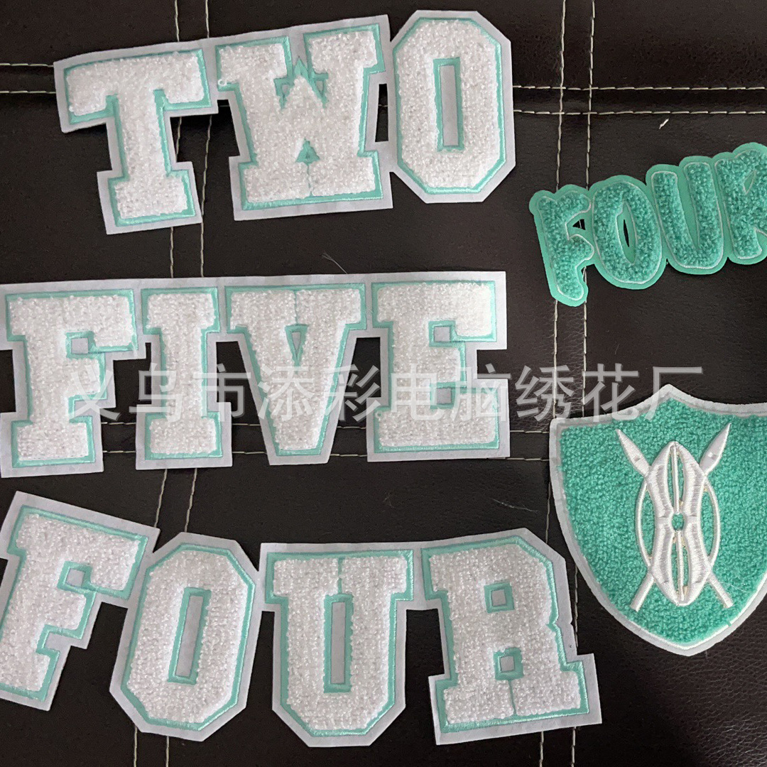 Yiwu wool embroidery towel embroidery flat embroidery mixed embroidery towel embroidery label towel embroidery embroidery plus factory