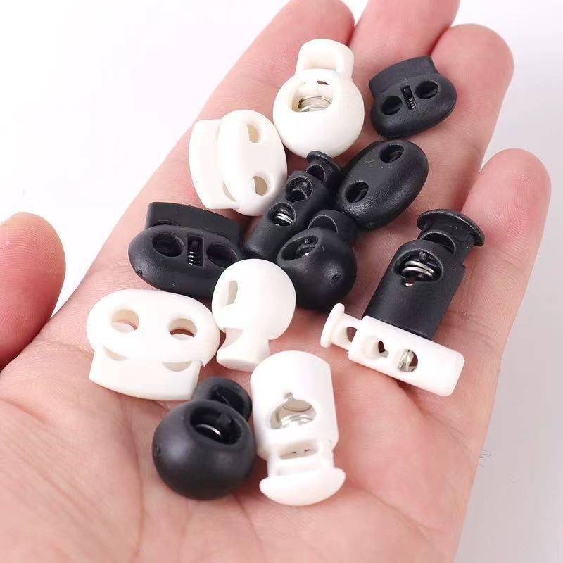 Manufacturer's Ready-Made Wholesale Plastic Spring Buckle Spherical Ball Single Hole Drawstring Hat Rope Buckle Black and White Transparent Spring