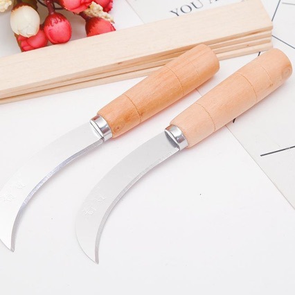 White wooden handle machete pineapple knife