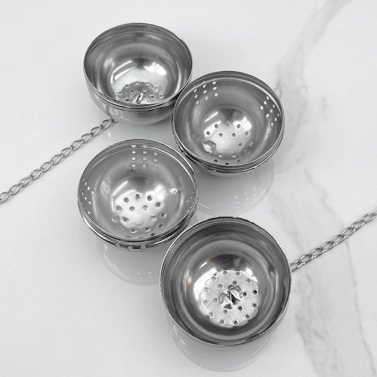 Cross-border wholesale stainless steel seasoning ball household kitchen spice filter ball with chain tea drain filter halogen ball