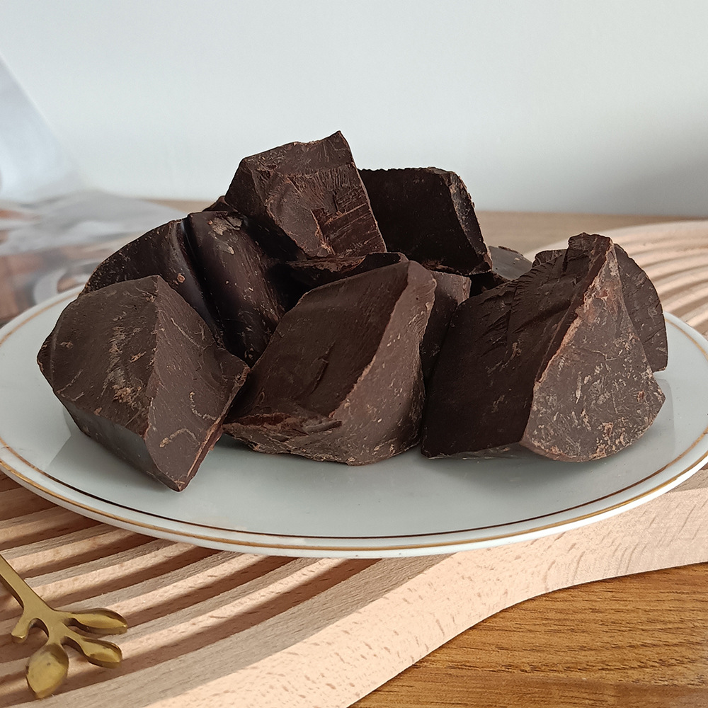 Wholesale Xingguang cocoa liquid block 52% fat-containing pure dark chocolate baking raw material ketogenic fitness sugar-free 15KG