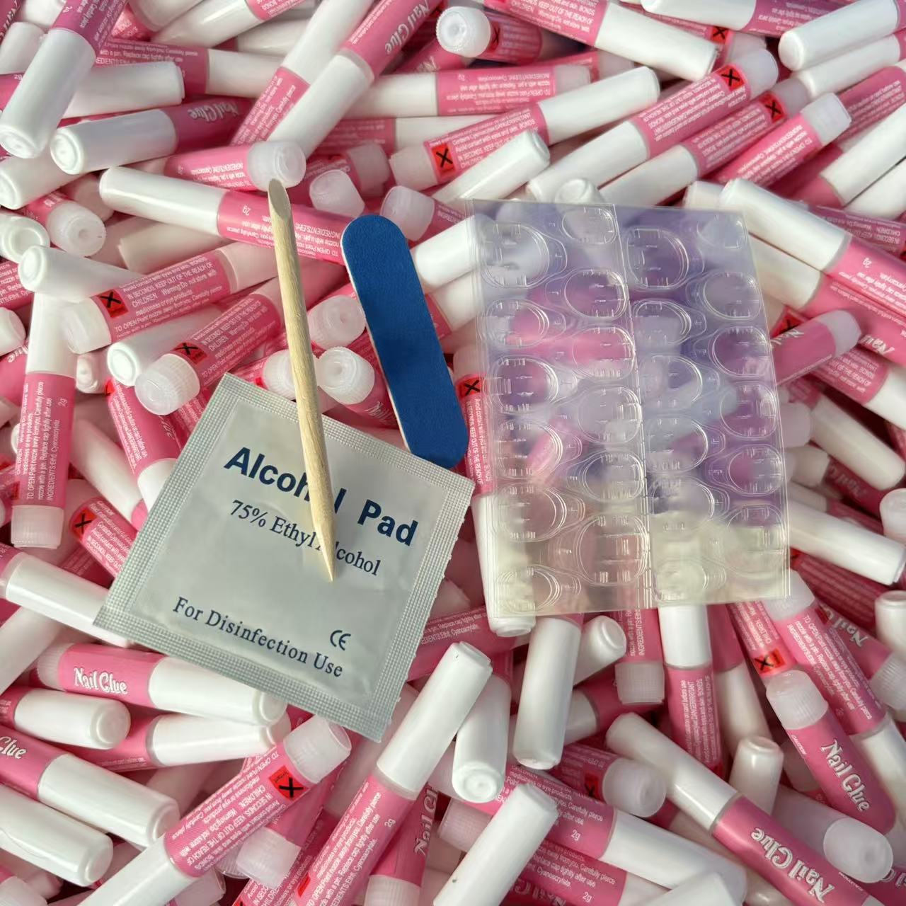 Yiwu manufacturers in stock 2g red tube glue wear nail glue quick-drying nail glue drill glue fake nail glue