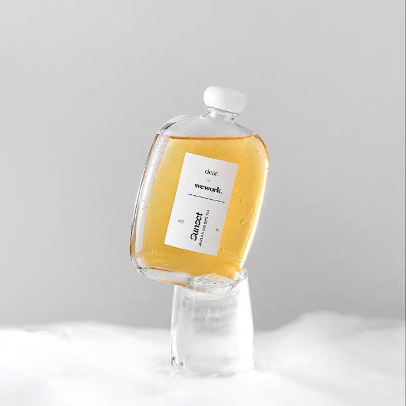 Factory in stock flat bottle beverage milk tea coffee glass bottle mushroom flat bottle sealed leak-proof flat round empty bottle with lid