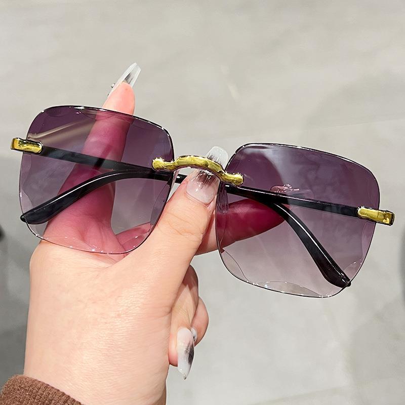 2022 new European and American fashion sunglasses Women's Big face slimming sunglasses frameless trim sunglasses wholesale