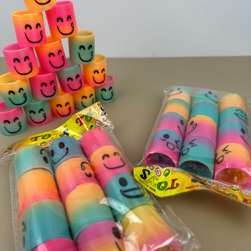 Cross-Border Rainbow Circle Expression Smiley Face Bouncing Circle Children's Educational Spring Circle Toy Yiwu Wholesale Gift Stall